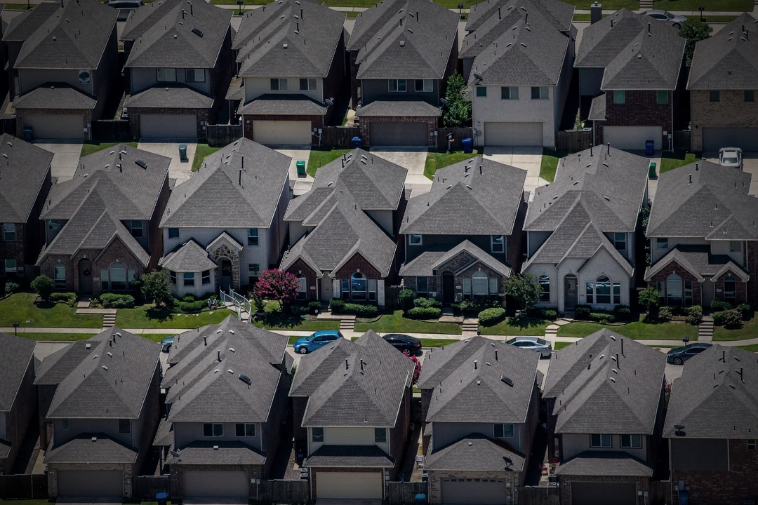 Dense suburban rooftops stretching in every direction
